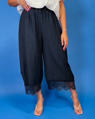 Drawstring Lace Hem Pants featuring a relaxed fit, elastic drawstring waist, and elegant lace hem