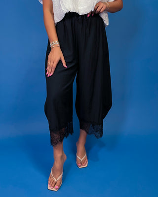 Drawstring Lace Hem Pants featuring a relaxed fit, elastic drawstring waist, and elegant lace hem
