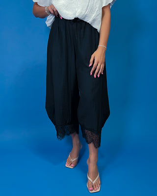 Drawstring Lace Hem Pants featuring a relaxed fit, elastic drawstring waist, and elegant lace hem