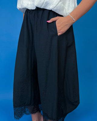 Drawstring Lace Hem Pants featuring a relaxed fit, elastic drawstring waist, and elegant lace hem