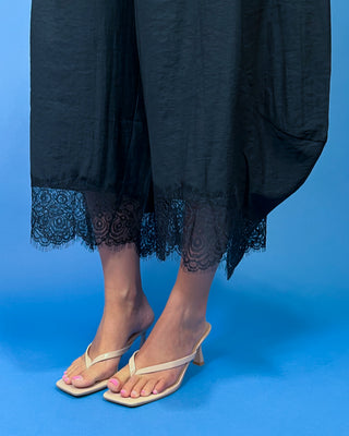 Drawstring Lace Hem Pants featuring a relaxed fit, elastic drawstring waist, and elegant lace hem