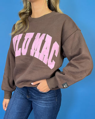 Chocolate brown Lulu Mac graphic crewneck sweatshirt with bold pink varsity lettering, long sleeves, ribbed trim, and a relaxed fit.
