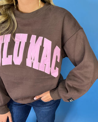 Chocolate brown Lulu Mac graphic crewneck sweatshirt with bold pink varsity lettering, long sleeves, ribbed trim, and a relaxed fit.