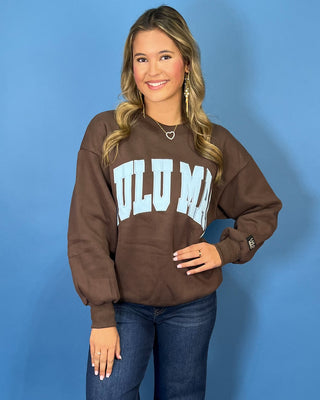 Chocolate brown Lulu Mac graphic crewneck sweatshirt with light blue varsity lettering, long sleeves, ribbed trim, and a relaxed fit.