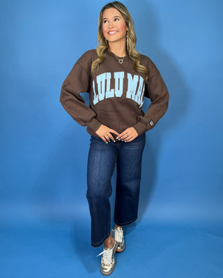 Chocolate brown Lulu Mac graphic crewneck sweatshirt with light blue varsity lettering, long sleeves, ribbed trim, and a relaxed fit.