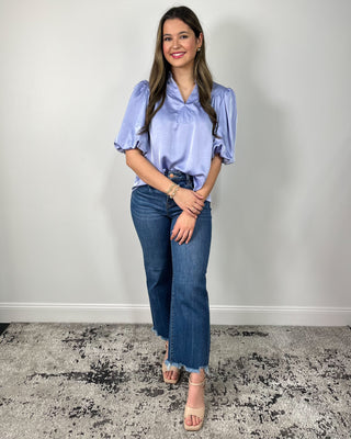 Soft, sleek, and effortlessly chic 💙 This silky lavender blouse features a flattering notched neckline and statement puff sleeves that instantly elevate your everyday denim—perfect for work, dinner, or anything in between!