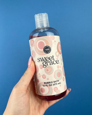 Shop the Sweet Grace Bubble Bath 16 oz by Bridgewater Candle Company. Enjoy a relaxing bath with notes of passion fruit, sparkling tea, and patchouli.