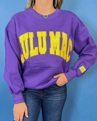 Purple Lulu Mac graphic crewneck sweatshirt with bold gold varsity lettering, long sleeves, ribbed trim, and a relaxed fit.