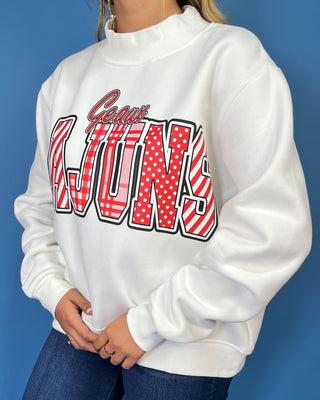White Geaux Cajuns graphic sweatshirt with bold red mixed-print lettering, mock neckline, long sleeves, and a relaxed fit.