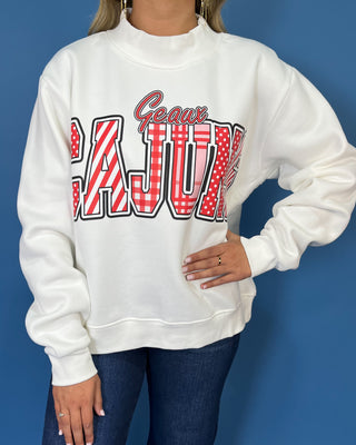 White Geaux Cajuns graphic sweatshirt with bold red mixed-print lettering, mock neckline, long sleeves, and a relaxed fit.