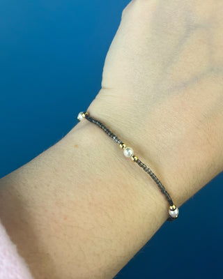 Shop the Hope Purpose Pearl Moonlight Bracelet by enewton, featuring delicate gray beads, white pearl accents, and gold details for timeless everyday style.