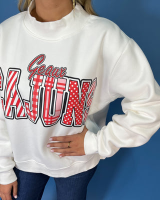 White Geaux Cajuns graphic sweatshirt with bold red mixed-print lettering, mock neckline, long sleeves, and a relaxed fit.