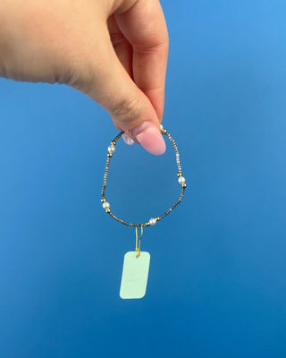 Shop the Hope Purpose Pearl Moonlight Bracelet by enewton, featuring delicate gray beads, white pearl accents, and gold details for timeless everyday style.