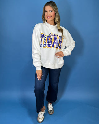White Geaux Tigers graphic sweatshirt with bold purple mixed-print lettering, gold accents, mock neckline, long sleeves, and a relaxed fit.