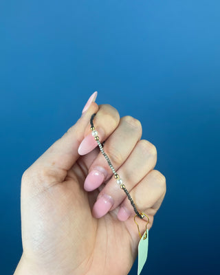 Shop the Hope Purpose Pearl Moonlight Bracelet by enewton, featuring delicate gray beads, white pearl accents, and gold details for timeless everyday style.