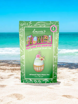 Packaging of Florida Key Lime Pie Martini mix on a beach with ocean view