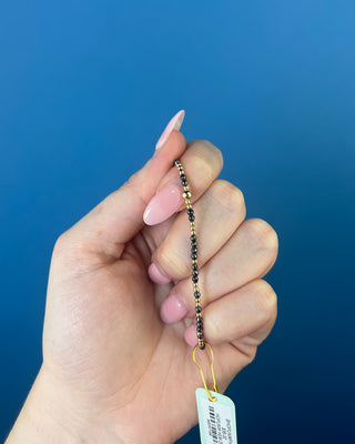 Shop the Hope Unwritten Faceted Hematite 2mm Bracelet by enewton, featuring dark faceted hematite beads and polished gold accents for everyday style.