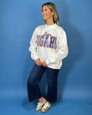 White Geaux Tigers graphic sweatshirt with bold purple mixed-print lettering, gold accents, mock neckline, long sleeves, and a relaxed fit.
