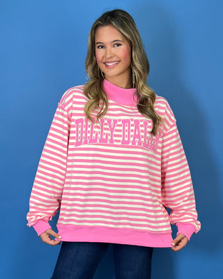 Pink and cream striped Dolly Dally graphic sweatshirt with a mock neckline, long sleeves, contrast pink trim, and relaxed oversized fit.