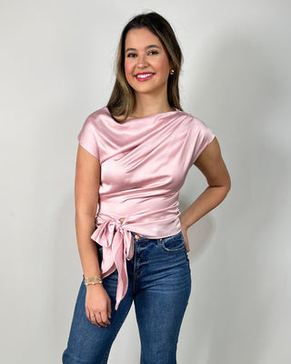 Blush satin tie-front top with a soft draped neckline, styled with cropped raw-hem flare jeans and nude block heels for an easy dressy-casual look. Perfect for date night, brunch, or any event where you want to feel polished without trying too hard.