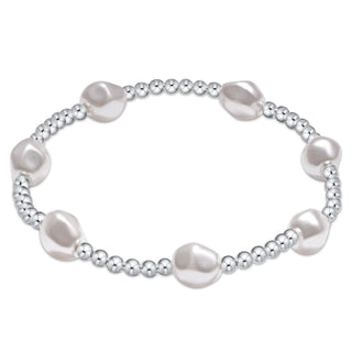 Pearl bracelet with silver beads on a white background