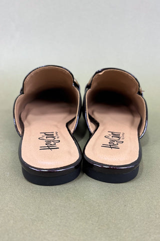 Black sandals with 'Hey Girl' branding on a light green background