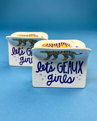 White oversized LSU-inspired claw hair clip featuring a "Let's Geaux Girls" design with purple and gold accents and a secure spring hinge.