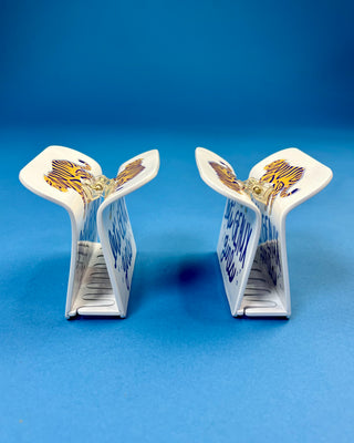 White oversized LSU-inspired claw hair clip featuring a "Let's Geaux Girls" design with purple and gold accents and a secure spring hinge.