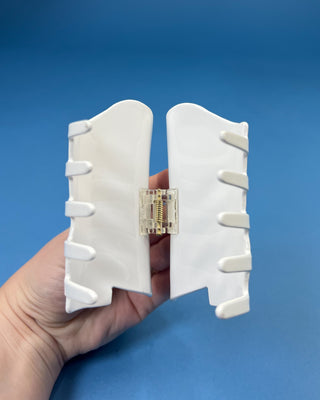 White Boot LSU-inspired claw hair clip featuring a purple & gold tassel design with purple and gold accents and a secure spring hinge.