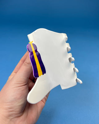 White Boot LSU-inspired claw hair clip featuring a purple & gold tassel design with purple and gold accents and a secure spring hinge.