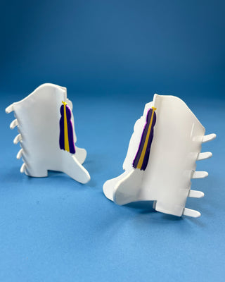 White Boot LSU-inspired claw hair clip featuring a purple & gold tassel design with purple and gold accents and a secure spring hinge.