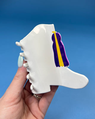 White Boot LSU-inspired claw hair clip featuring a purple & gold tassel design with purple and gold accents and a secure spring hinge.