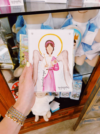 Hand Holding religious artwork in a store setting