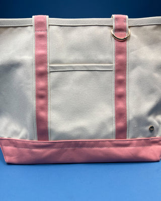 Large heavyweight canvas tote bag with contrast trim, reinforced shoulder straps, exterior slip pocket, and spacious interior available in multiple colors.