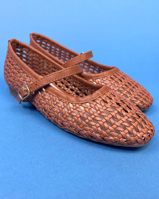 A pair of woven brown leather Mary Jane flats