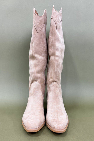Pair of pink suede knee-high boots on a gray background