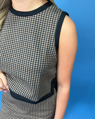 Brown and black gingham sleeveless top and matching skort set with contrast black trim.
