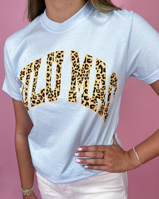 White t-shirt with leopard print text on a pink background