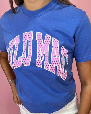 Blue t-shirt with pink text on a pink background
