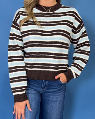 Blue, cream, and brown striped long sleeve sweater with crew neckline and contrast brown trim.
