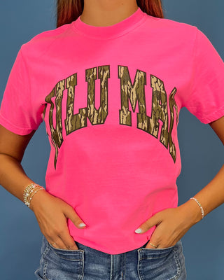 a bright pink t-shirt with 'LULU MAC' printed in a camo-print arched graphic across the chest