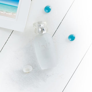 Turquoise earrings on a white surface with a blurred background