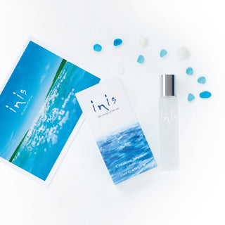 Inis cologne bottle and packaging on a white background