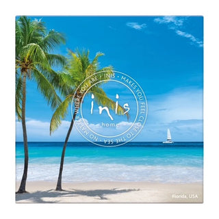 Canvas print with a tropical beach scene featuring palm trees and a sailboat, with 'INIS' branding.