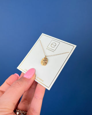 Enewton Inspire Small Gold Disc Cross Necklace featuring a textured oval gold pendant with a raised cross on a delicate 16-in