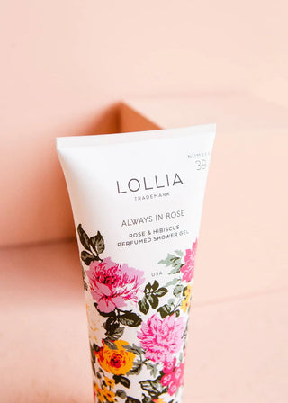 Lollia 'Always in Rose' shower gel tube on a soft pink background