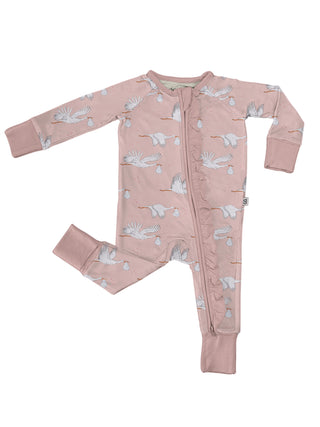 A baby long-sleeve footless one-piece sleeper in dusty pink, featuring an allover print of white cranes carrying eggs, laid flat on a white background.