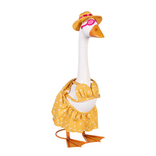 Decorative goose figure wearing a yellow polka dot dress and hat on a white background