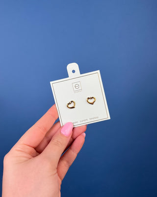 Enewton Gold Love Stud Earrings featuring polished open heart 14kt gold-filled studs displayed on an Enewton jewelry card.