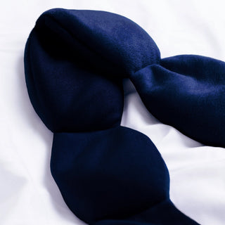 Navy blue eye mask on a white background